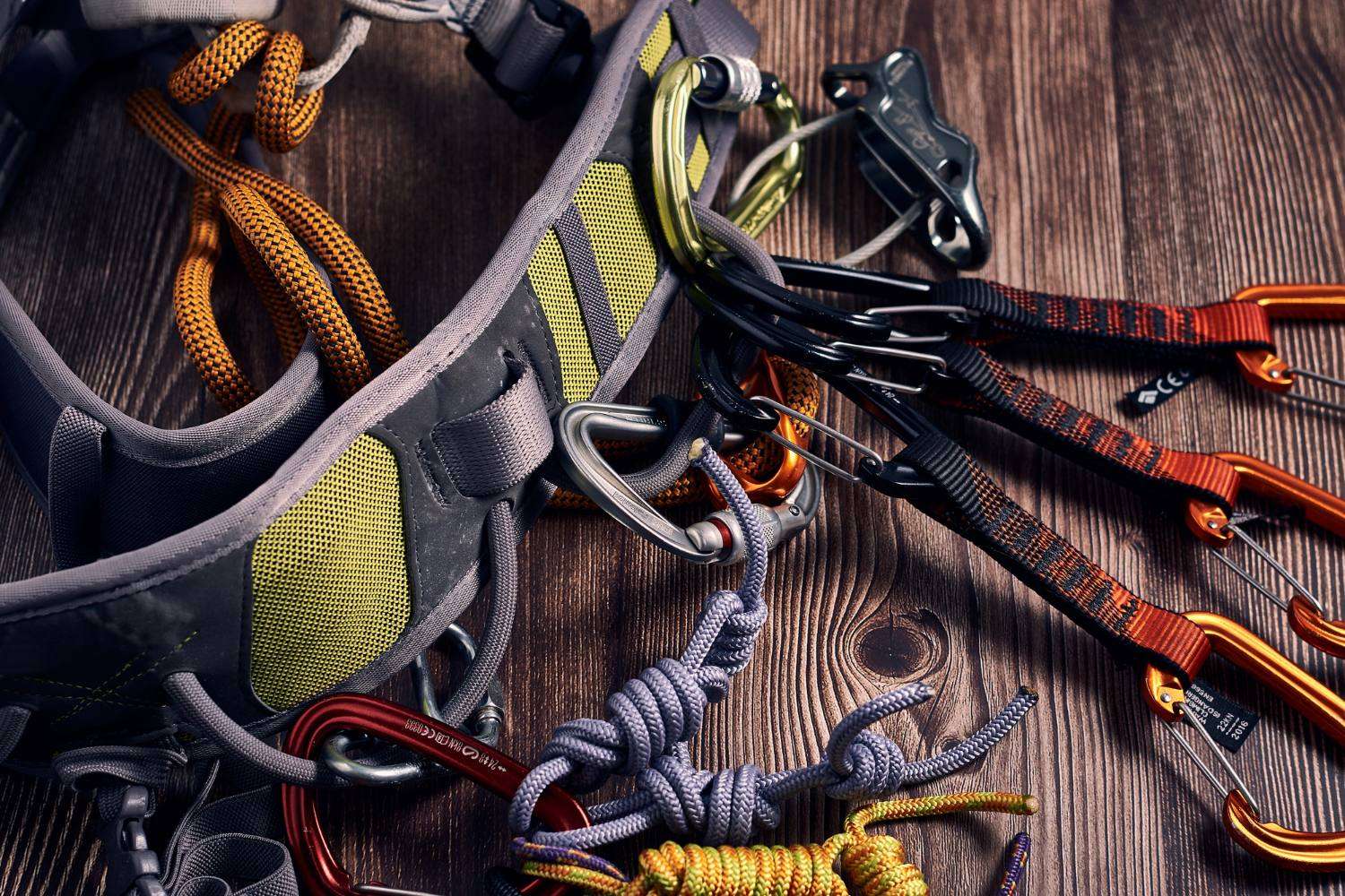 Harness, karabiners, ropes and quickdraws laid out for inspection